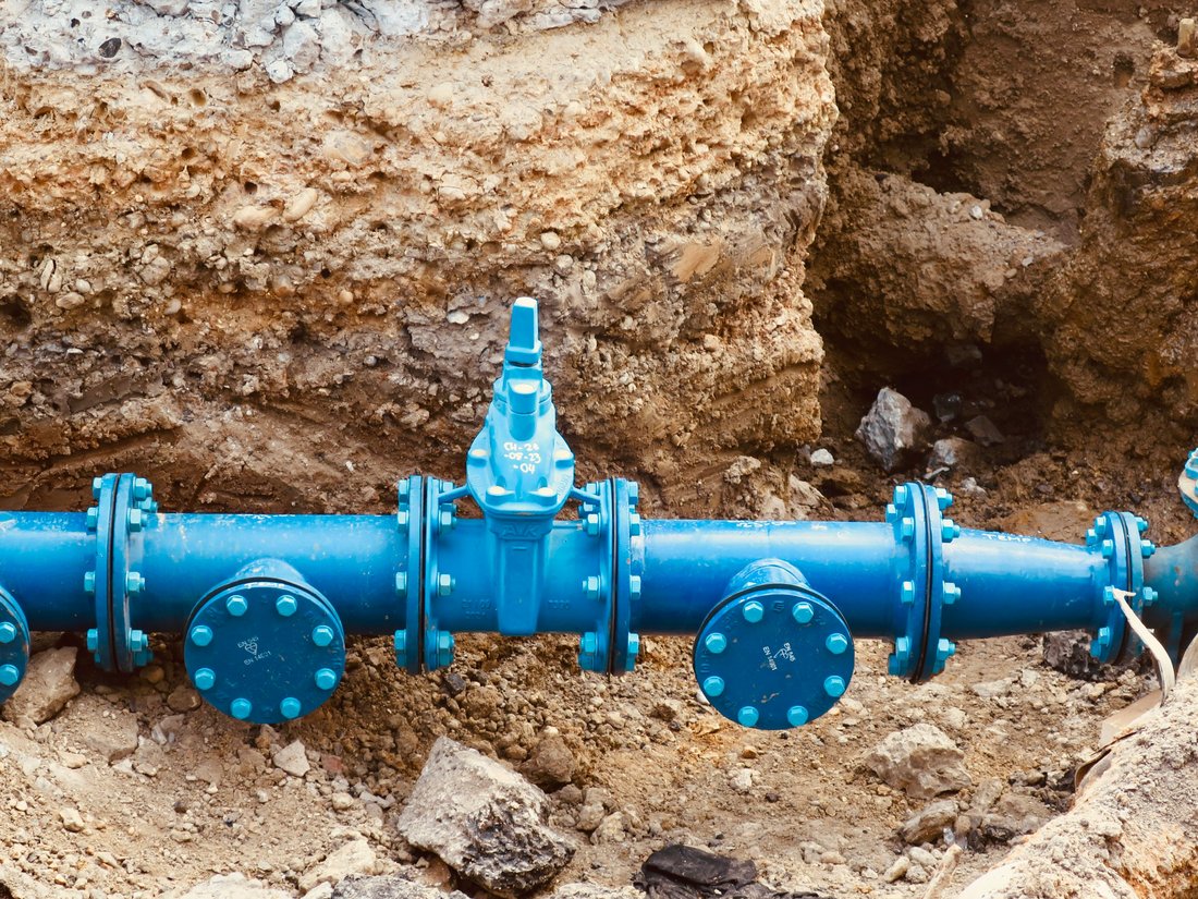 Water main pipe fittings installed in a trench